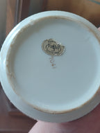 antique porcelain coasters in carry cage